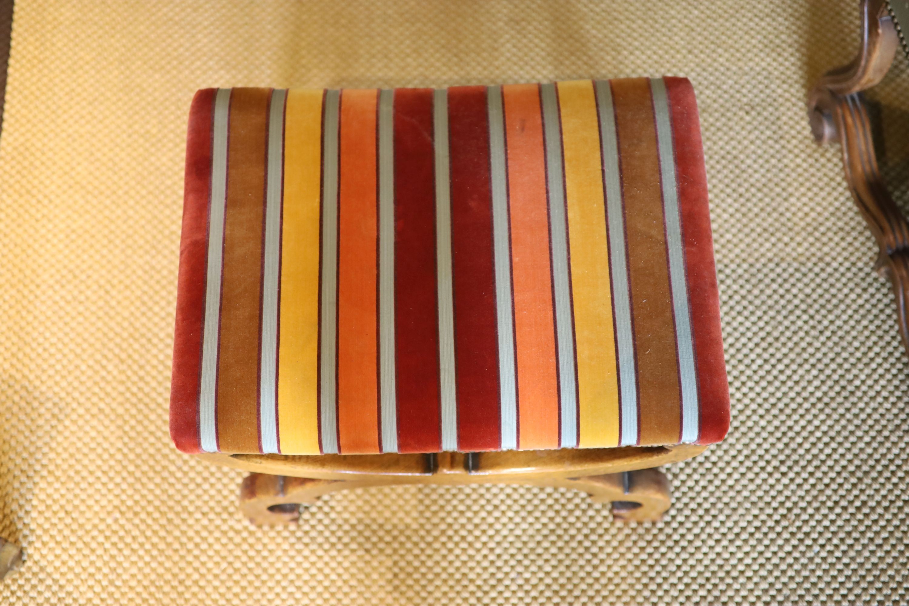A Victorian X frame oak foot stool, with striped fabric upholstery, 54 x 40cm height 45cm